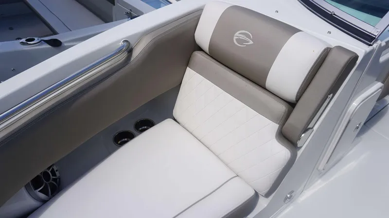 Slide: The Image of 2024 Crownline 240 DC boat seat with elegant white and gray upholstery. - 6