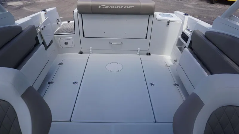 Slide: The Image of 2024 Crownline 240 DC boat interior with spacious seating and storage compartments. - 9