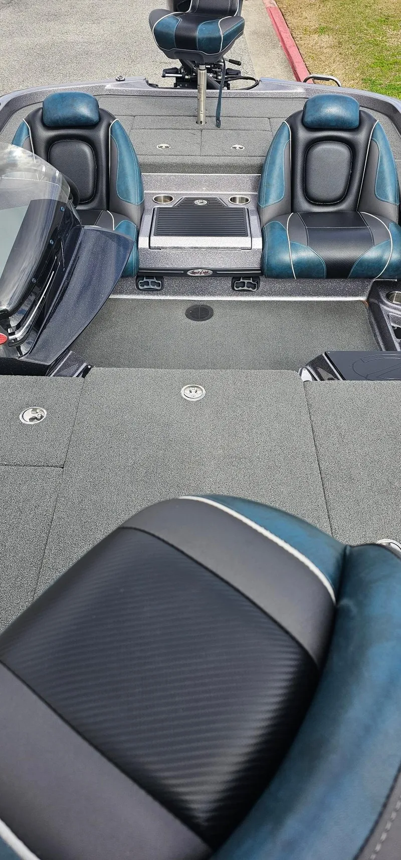 Slide: The Image of 2017 Ranger 518 boat interior with cushioned seats and spacious deck. - 4