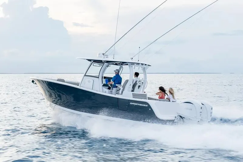 The Image of 2026 Sportsman Open 302 Center Console boat displayed outdoors under clear sky. - 1