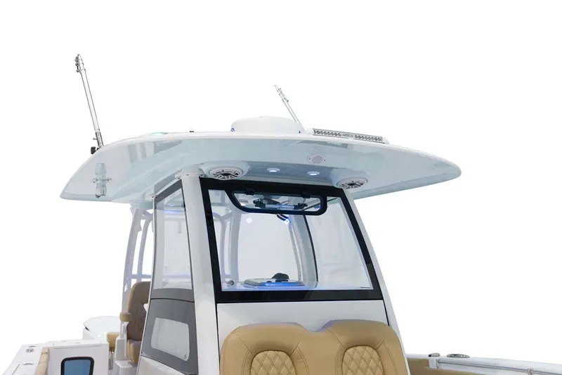 Slide: The Image of 2026 Sportsman Open 302 Center Console boat with luxurious white seating. - 11