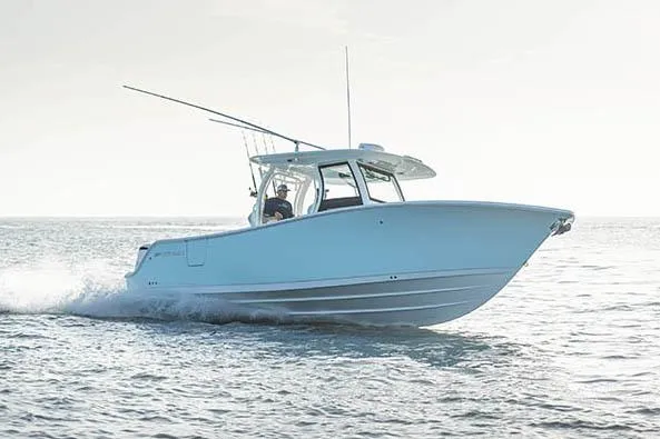 Slide: The Image of 2026 Sportsman Open 302 Center Console boat interior with seating and storage. - 7