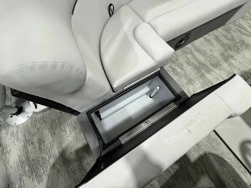 Slide: The Image of 2024 Crest Classic LX 200 boat seat with open storage compartment. - 10