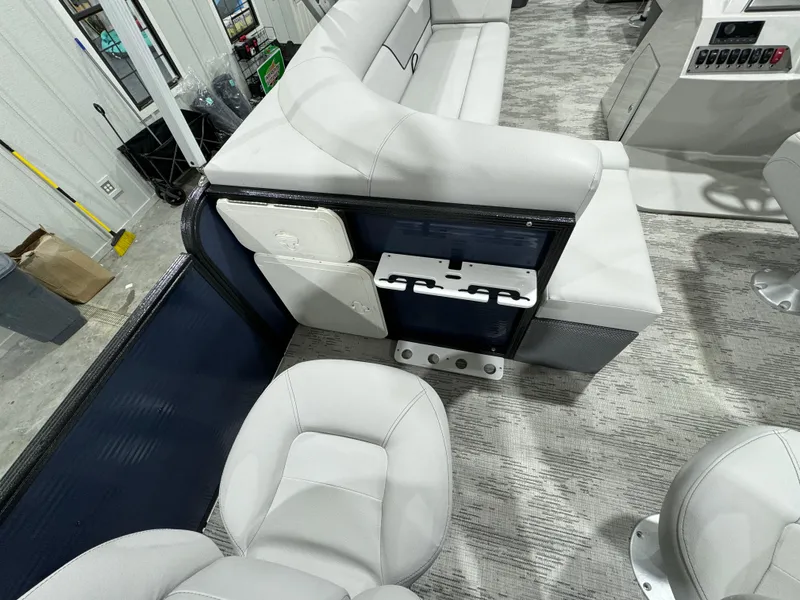 Slide: The Image of 2024 Crest Classic LX 200 boat interior with plush seating and modern design. - 16