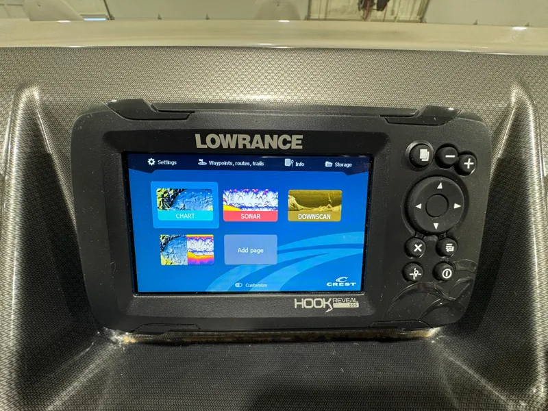Slide: The Image of Lowrance fish finder on 2024 Crest Classic LX 200 boat dashboard. - 17