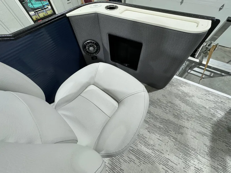 Slide: The Image of 2024 Crest Classic LX 200 boat interior with plush seating and speaker system. - 6