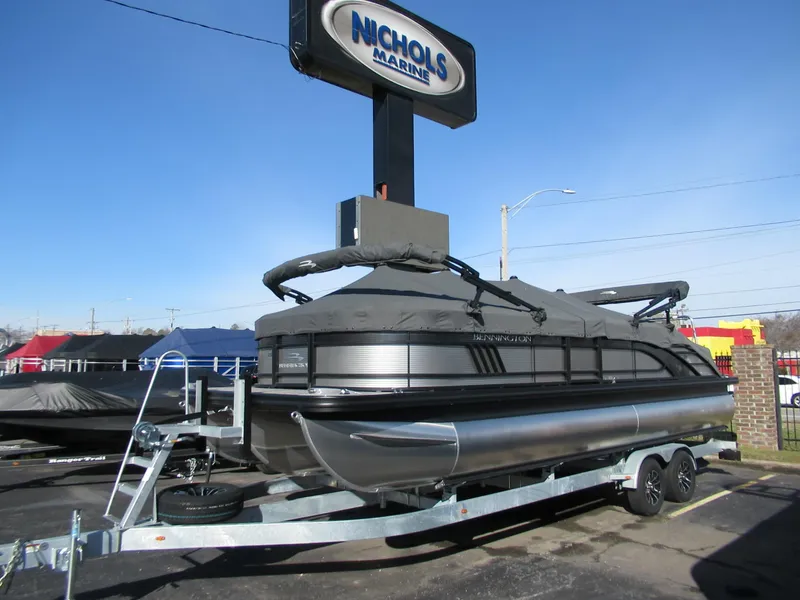 Slide: The Image of 2024 Bennington 25 LSB pontoon boat on trailer at Nichols Marine dealership. - 4