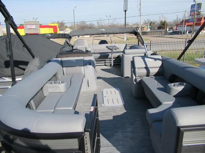 Slide: The Image of 2024 Bennington 25 LSB pontoon boat with spacious seating and modern design. - 5