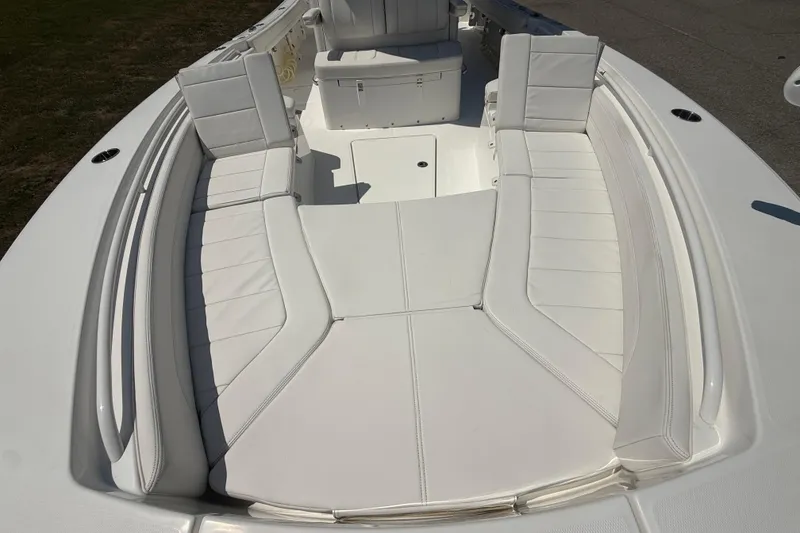 Slide: The Image of 2023 Regulator 26XO boat with spacious white seating area. - 35