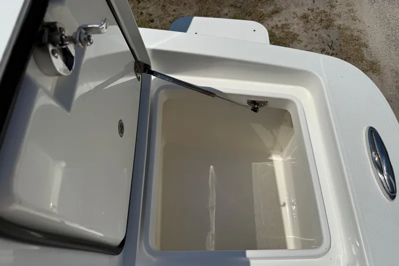 Slide: The Image of Open storage compartment on 2023 Regulator 26XO boat, showcasing interior space. - 45