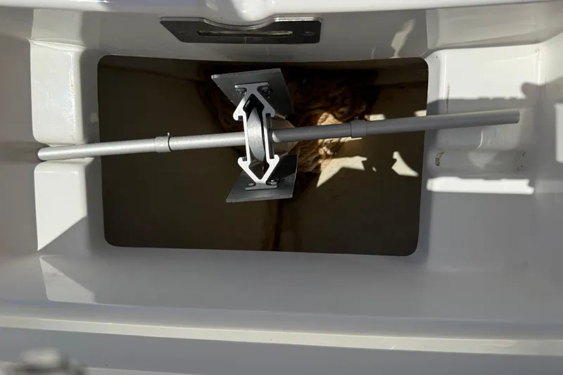 Slide: The Image of Anchor storage compartment on 2023 Regulator 26XO boat, featuring a neatly secured anchor. - 41