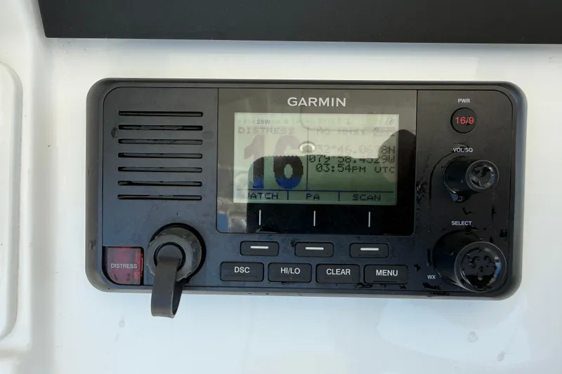 Slide: The Image of Garmin marine radio on 2023 Regulator 26XO boat, displaying distress signal. - 19
