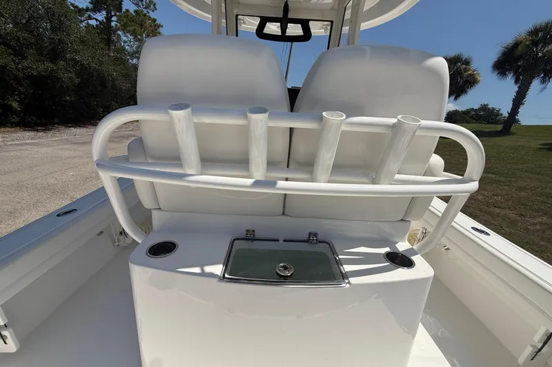 Slide: The Image of 2023 Regulator 26XO boat interior with rod holders and seating. - 28