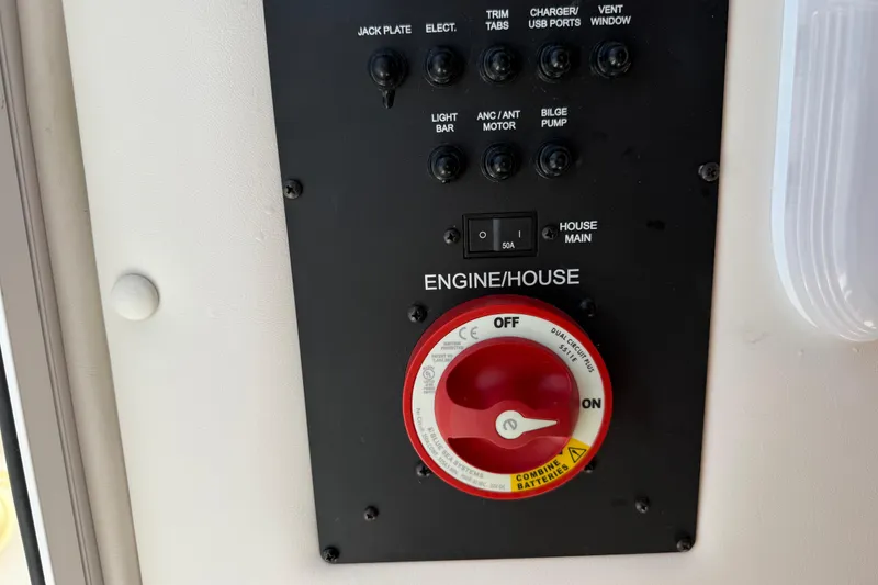 Slide: The Image of Control panel of 2023 Regulator 26XO boat with switches and battery selector. - 40