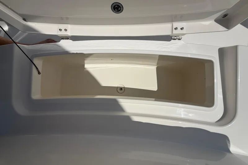 Slide: The Image of Open storage compartment on 2023 Regulator 26XO boat, showcasing interior space. - 43