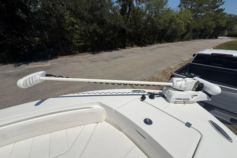 Slide: The Image of 2023 Regulator 26XO boat with Minn Kota trolling motor on deck. - 38