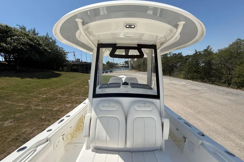 Slide: The Image of 2023 Regulator 26XO boat with sleek design and spacious seating. - 29