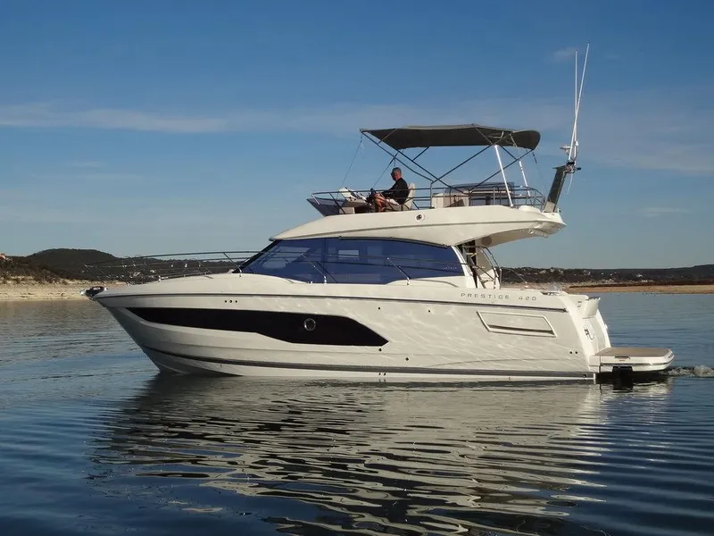 Slide: The Image of 2024 Prestige 420F yacht cruising on calm waters. - 1