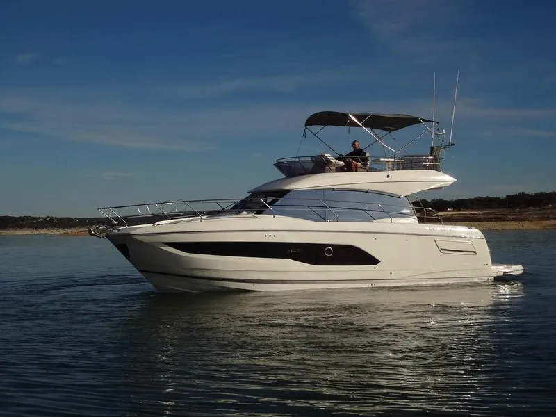 Slide: The Image of 2024 Prestige 420F yacht on calm water. - 11