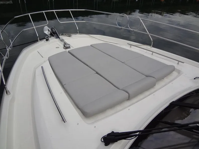 Slide: The Image of 2024 Prestige 420F yacht with spacious sunbathing area on the bow. - 16