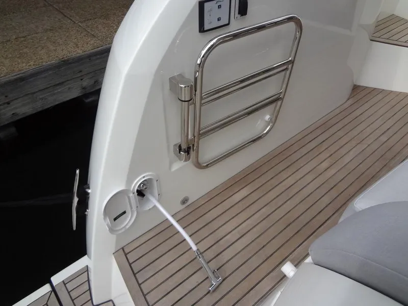 Slide: The Image of 2024 Prestige 420F yacht deck with stainless steel ladder and teak flooring. - 20
