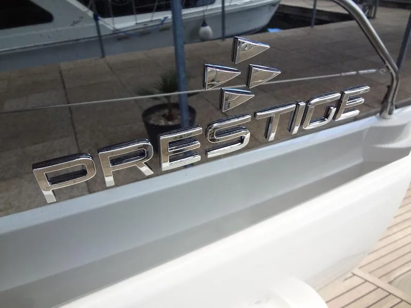 Slide: The Image of Prestige 420F 2024 yacht logo on boat exterior. - 21
