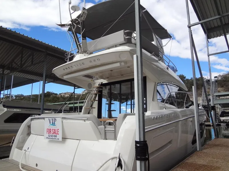 Slide: The Image of 2024 Prestige 420F yacht for sale at marina, rear view. - 23