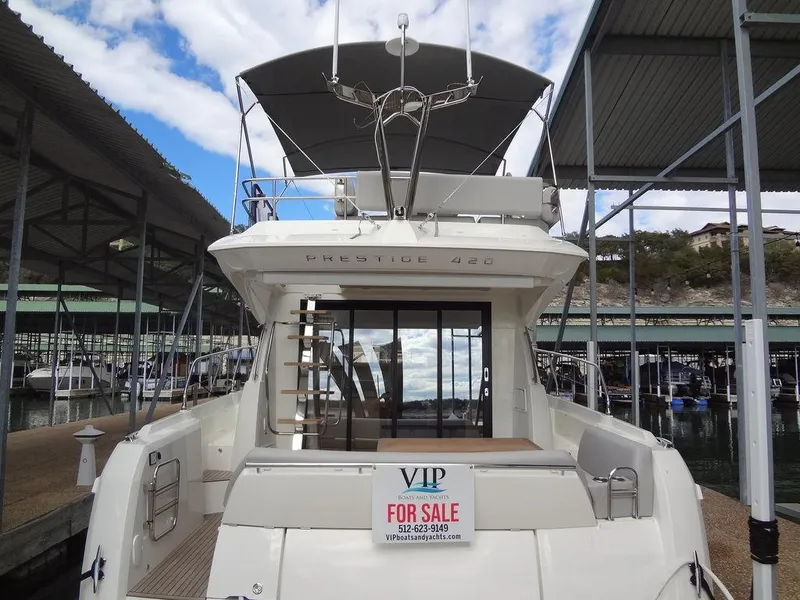 Slide: The Image of 2024 Prestige 420F yacht for sale at marina, rear view. - 25