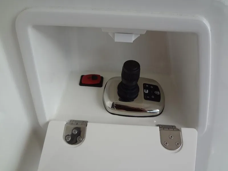 Slide: The Image of Control panel of 2024 Prestige 420F yacht with joystick and button. - 29
