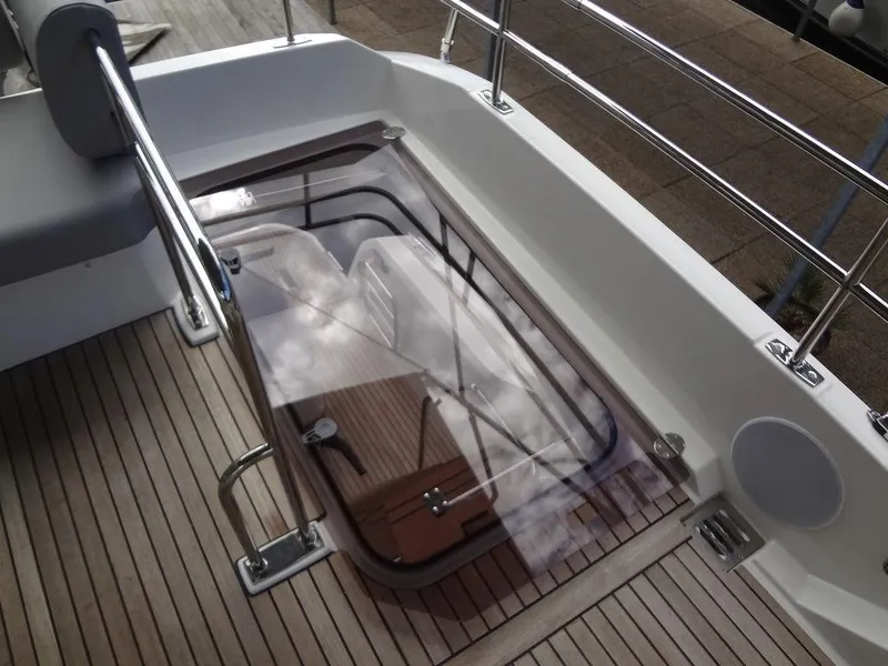 Slide: The Image of 2024 Prestige 420F yacht deck with glass hatch and stainless steel railings. - 31