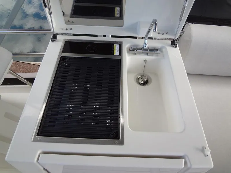 Slide: The Image of 2024 Prestige 420F yacht sink and grill station. - 34