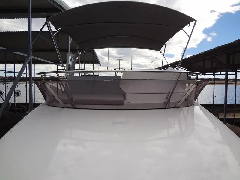 Slide: The Image of 2024 Prestige 420F yacht with shaded upper deck at marina. - 37