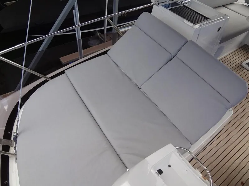 Slide: The Image of 2024 Prestige 420F yacht with spacious sunbathing area and cushioned seating. - 38