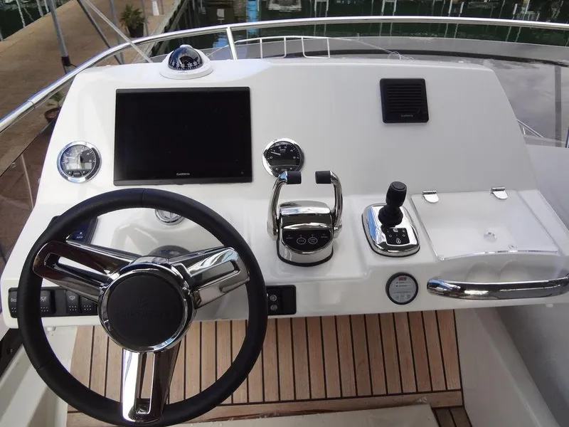 Slide: The Image of Prestige 420F 2024 yacht helm station with modern controls and navigation screen. - 39