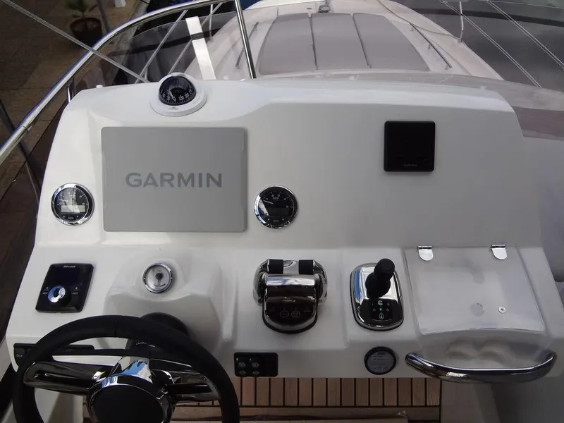Slide: The Image of 2024 Prestige 420F yacht helm with Garmin navigation system. - 41