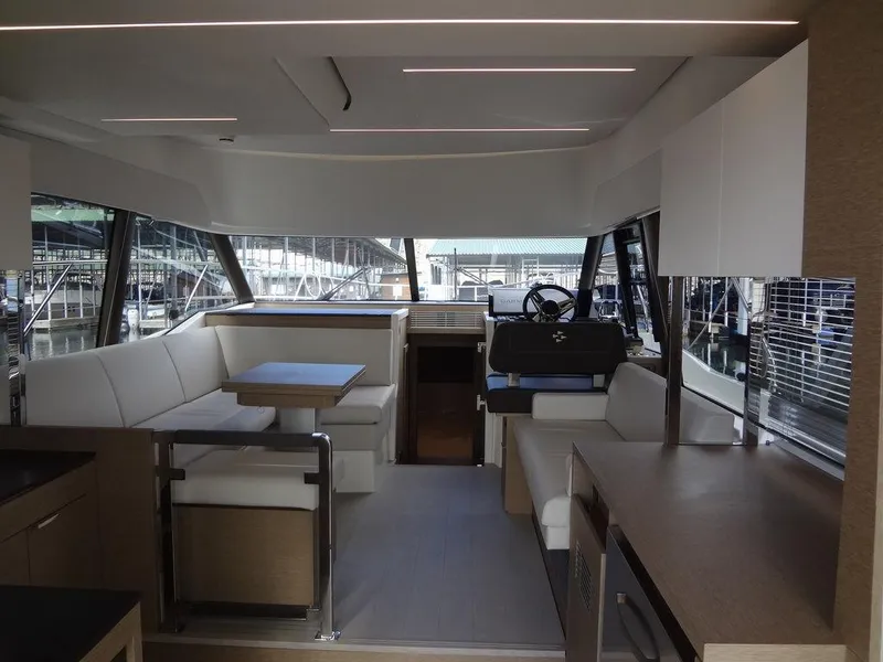 Slide: The Image of Interior of 2024 Prestige 420F yacht with modern seating and dining area. - 42
