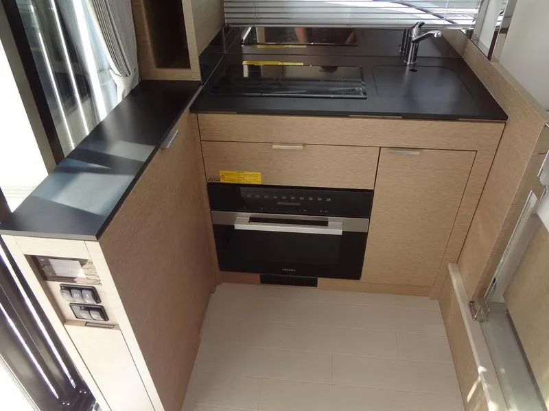 Slide: The Image of Modern kitchen in 2024 Prestige 420F RV with sleek cabinetry and built-in appliances. - 45