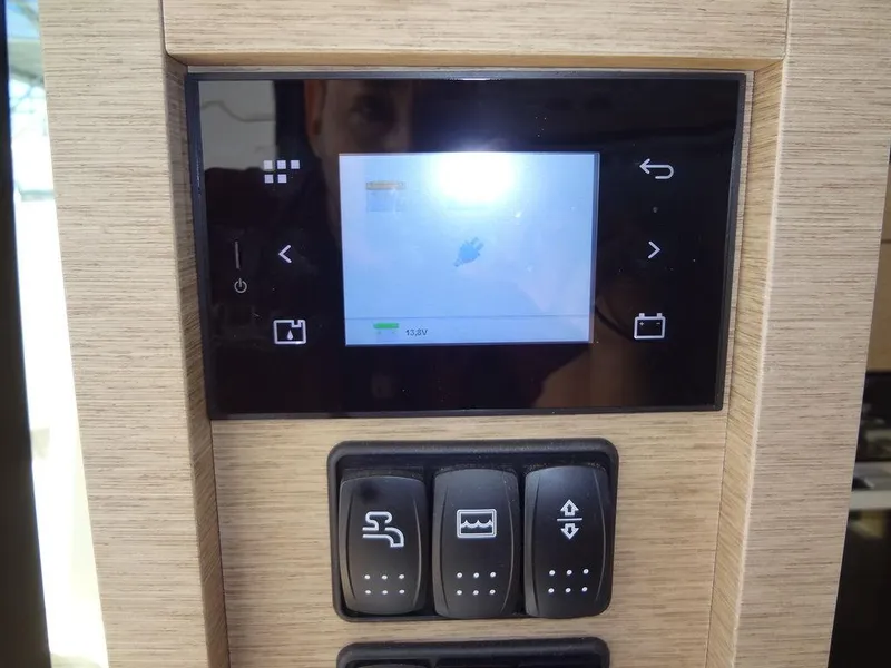 Slide: The Image of Control panel of 2024 Prestige 420F yacht with touchscreen and switches. - 47