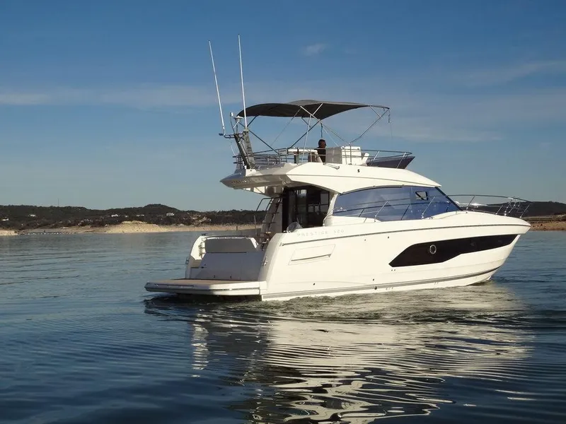 Slide: The Image of 2024 Prestige 420F yacht cruising on calm waters. - 5