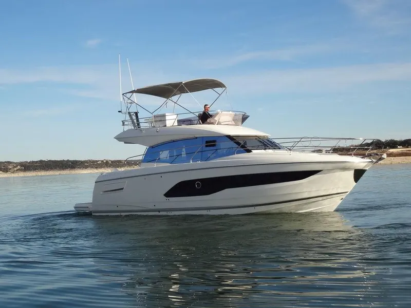 Slide: The Image of 2024 Prestige 420F yacht cruising on calm waters. - 8