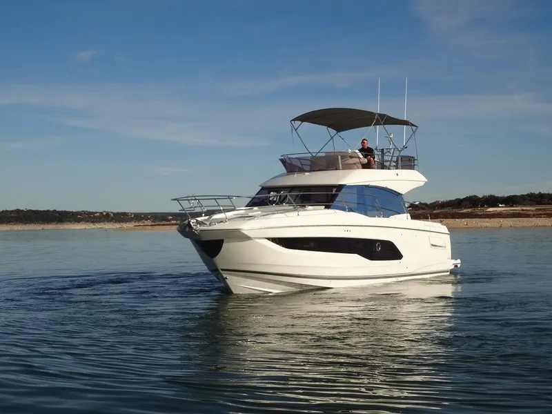 Slide: The Image of 2024 Prestige 420F yacht cruising on calm waters. - 9