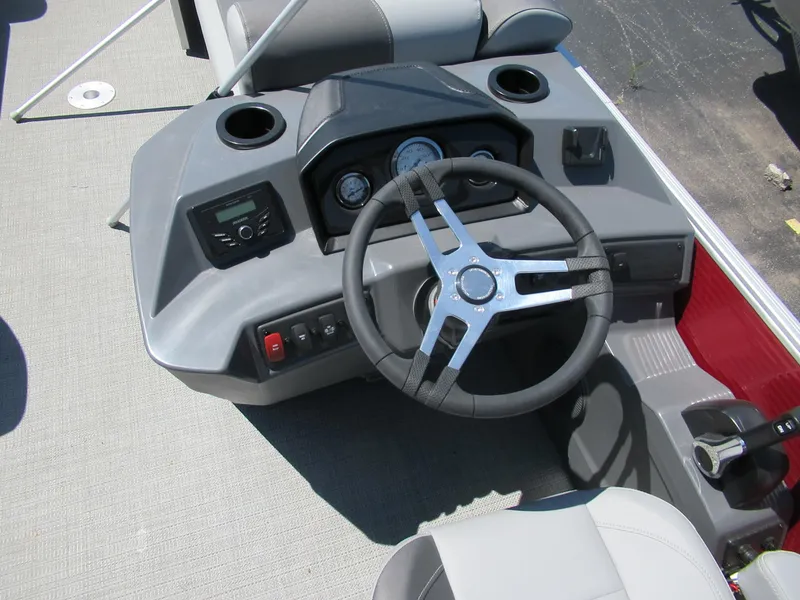 Slide: The Image of 2024 Bennington 22 SVSR boat dashboard with steering wheel and control panel. - 1