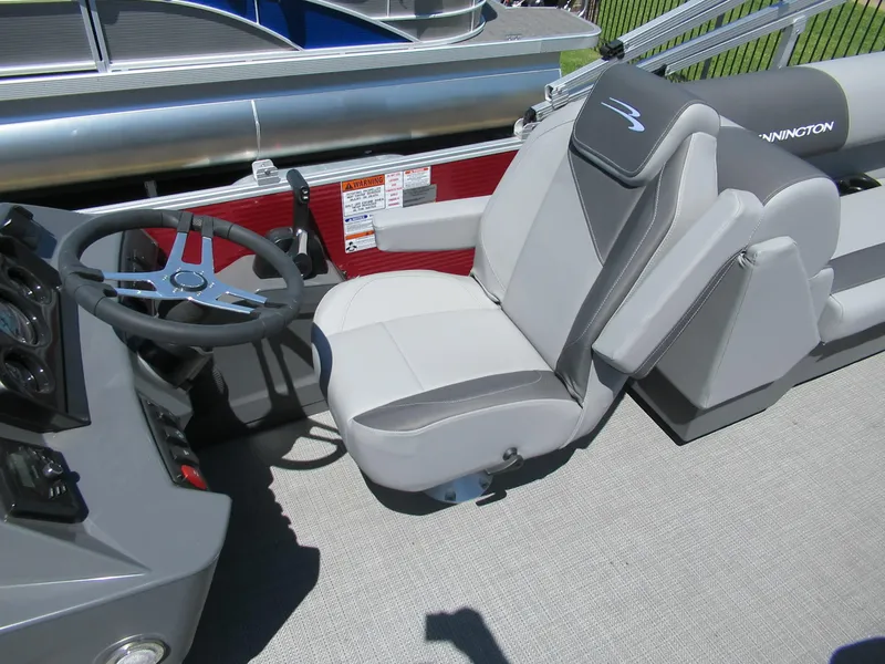 Slide: The Image of 2024 Bennington 22 SVSR boat captain's seat and steering console. - 2