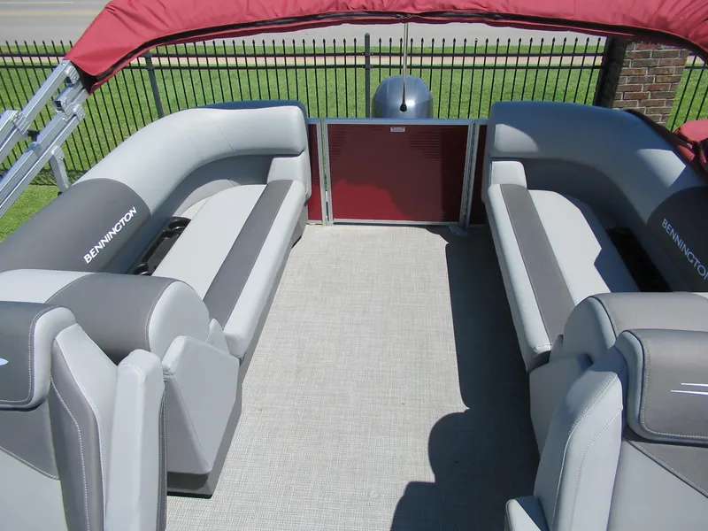 Slide: The Image of 2024 Bennington 22 SVSR pontoon boat with spacious seating and red canopy. - 4
