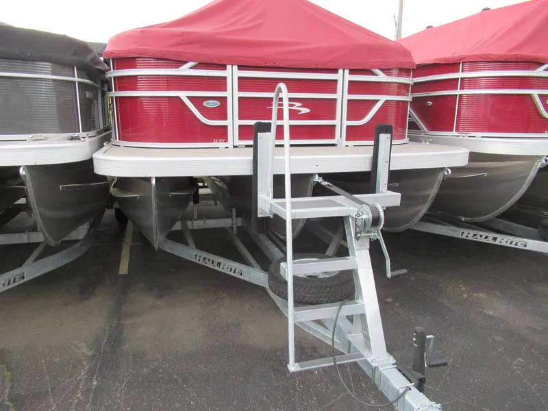 Slide: The Image of 2024 Bennington 22 SVSR pontoon boat with red cover on trailer. - 6