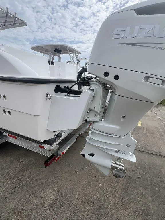 Slide: The Image of 2024 Twin Vee 280 STX boat with Suzuki outboard motor on a trailer. - 15