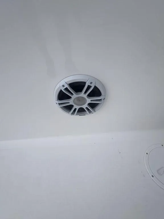 Slide: The Image of 2024 Twin Vee 280 STX boat speaker on white interior ceiling. - 22