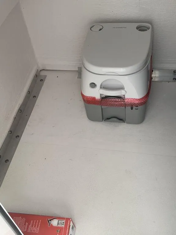 Slide: The Image of Portable toilet inside 2024 Twin Vee 280 STX boat cabin. - 25