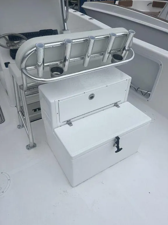 Slide: The Image of 2024 Twin Vee 280 STX boat with rod holders and storage compartments. - 7