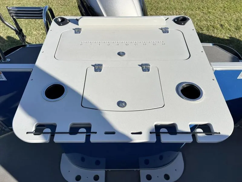 Slide: The Image of 2023 Starcraft CX 23 FD boat fishing station with rod holders and storage compartments. - 11